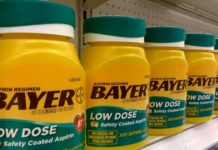 Low dose Aspirin 81mg. Why not 82mg? Baby Aspirin 81mg bottles on a shelf